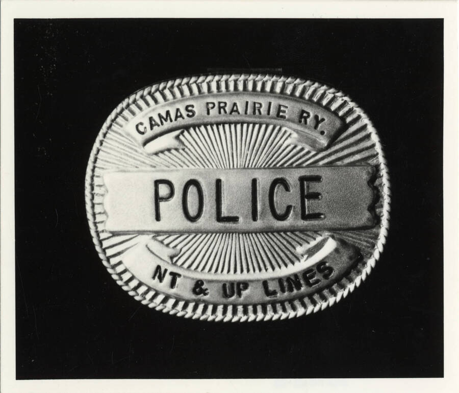 A Camas Prairie Railroad Police Badge, with the words 'NT & UP Lines' along the bottom.