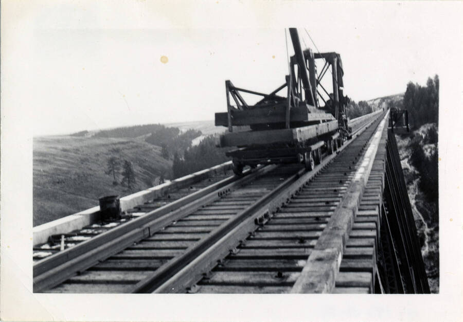 A photograph of railroad construction machinery sitting on bridge 38 of the Camas Prairie Railroad.