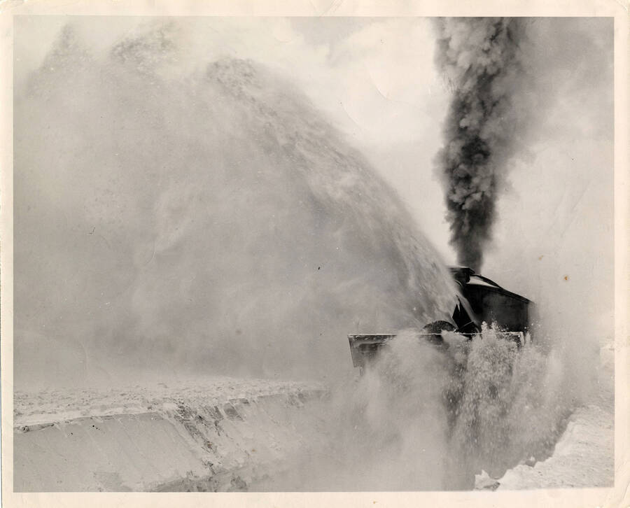 A photograph of a rotary snow plow at work at Fenn, Idaho on the Camas Railroad Company.