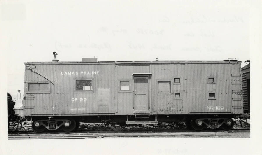 Camas Prairie CP 22's wrecker kitchen car resting on a railroad track.