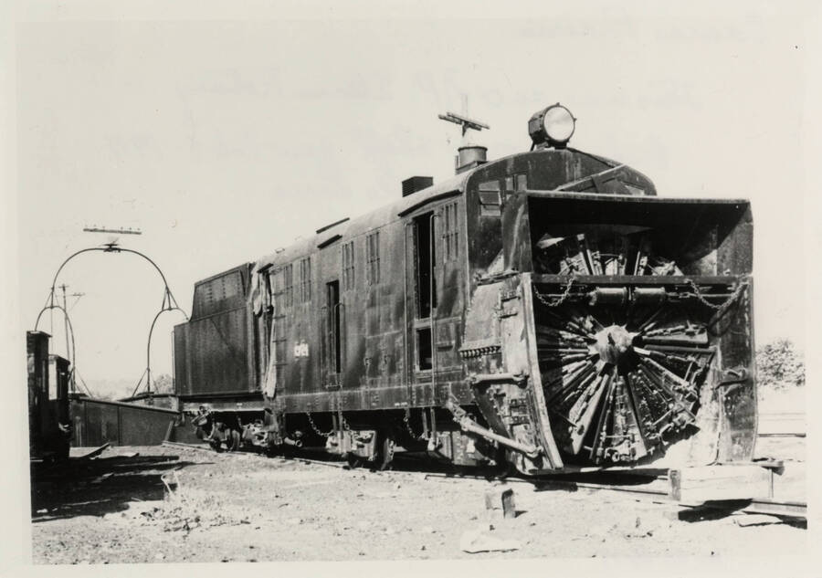An ex-Northern Pacific Steam Rotary, whose cross shaft was broken around January or February of 1971 on the Grangeville Line, is pictured collecting dust in a train yard.