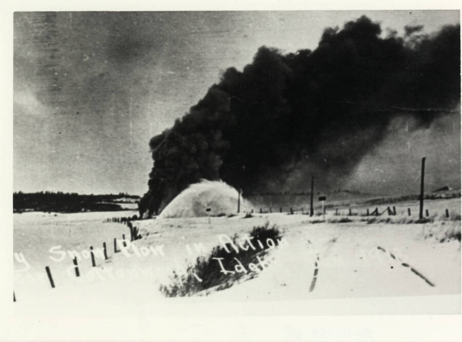 A Camas Prairie rotary snow plow amidst billows of smoke and snow.
