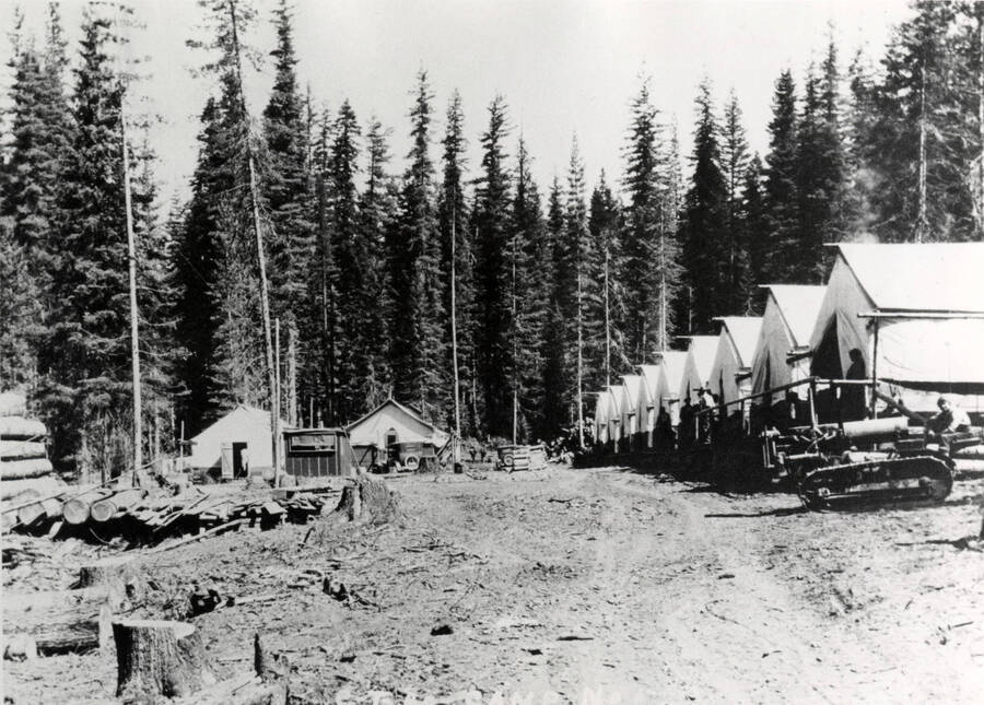 A photograph of an unidentified lumber camp in Potlatch, ID.