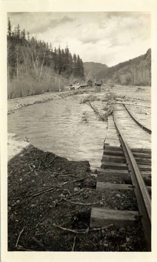 A photograph of a submerged railroad, possibly bridge 13.