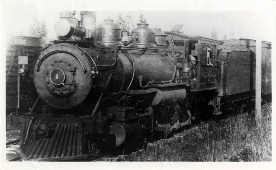 A photograph of Northern Pacific Train Engine no. 1 at Reubens, Idaho. This engine was specially built and originally hauled train supplies when the Cascades' Stampede Tunnel was built.