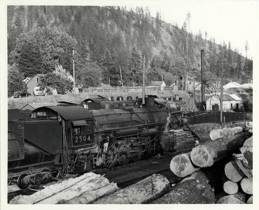 A photograph of train engine #2504 stopping for the night in Orofino after dropping off a shipment of log loads in Headquarters, Idaho.