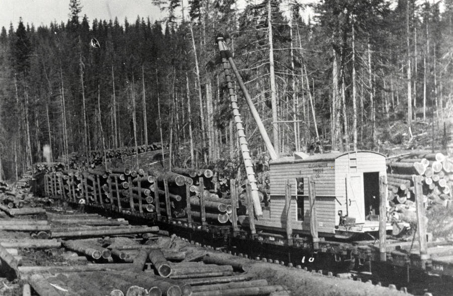 A photograph of what is colloquially known as a 'slide ass loader', describing a particular type of loading and transportation that is seen in this image.