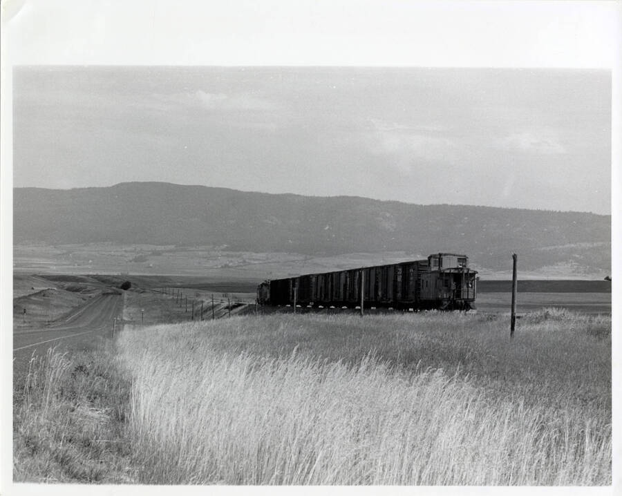 Train Engine No. 858 between Fenn and Grangeville. The Camas Prairie plateau's slope down toward Grangeville is evident in this picture.