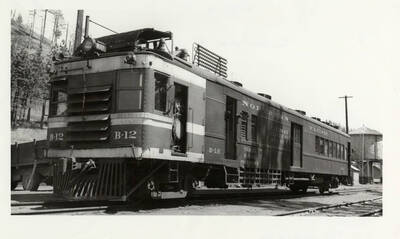 Northern Pacific's B-12 railway post office seen at what appears to be a railway station.