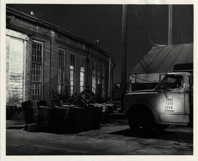 A photograph of a utility truck behind the roundhouse at the Lewiston Train Yards.