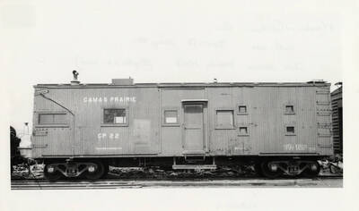 Camas Prairie CP 22's wrecker kitchen car resting on a railroad track.