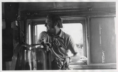 Engineer Ray at the controls of BN 1768 on train No. 881, the Kamiah Local, as it winds its way down the Clearwater River to tie up at Orofino.