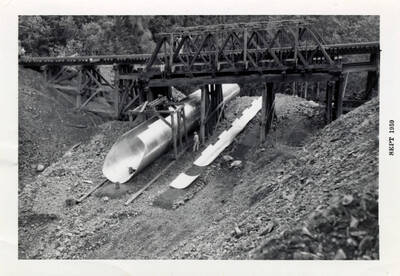 A photograph of Bridge 66, and some sort of metal structure, likely part of the construction equipment, underneath it.