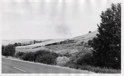 Train No. 858, the Grangeville Local, starts up the 4% grade in Lapwai Canyon near Culdesac.