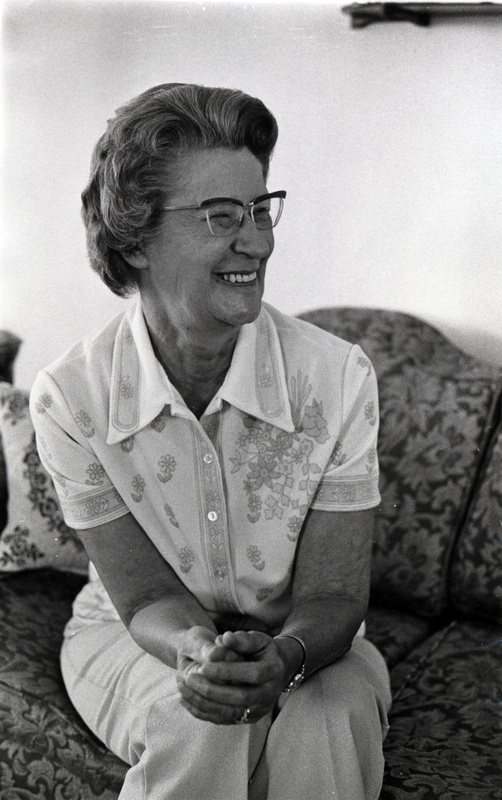 Photograph of Dorothy Moshinsky, seated, smiling away from the camera.