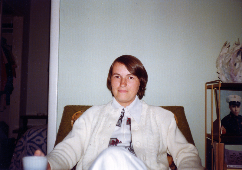 Photograph of Bonnie Nellsch seated, smiling at the camera.