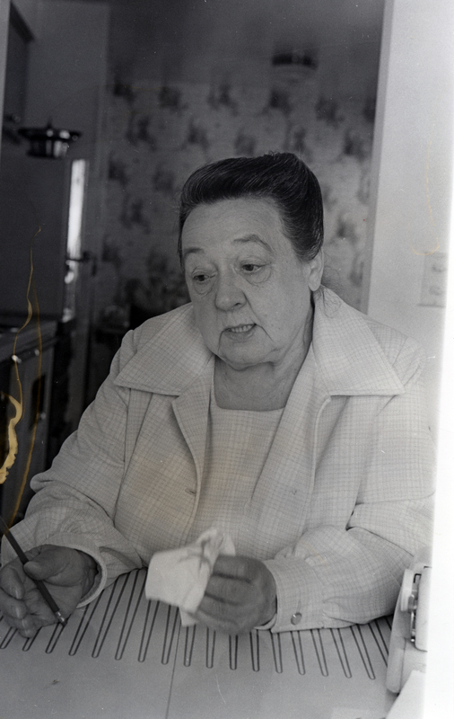 Photograph of Eva Peterson looking away from the camera.
