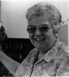 Photograph of Eunice Berry smiling, looking at the camera.