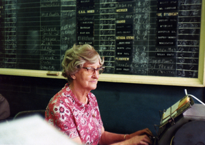 Color photograph of Eva Jannusch using a typwriter.