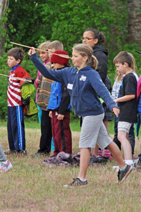 Students from Lewis and Clark school in Missoula at Travelers' Rest playing traditional native games that children centuries earlier used to hone future hunting skills. Photo courtesy of the TRSP facebook page.