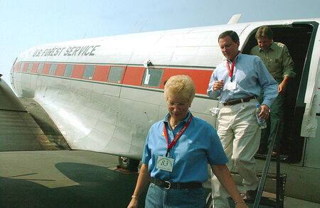An example of a US Forest Service DC-3. (Missoula, MT, September 2, 2003 - Montana Governor, Judy Martz, FEMA Director, Michael Brown and Forest Service representative, Bob Beckley tour the smoke jumper plane at the smoke jumper facility in Missoula. Photo by Andrea Booher/FEMA News Photo)