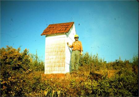 Dave Aldrich and Bad Luck Outhouse after Retardant Drop. Photo by Bob Mutch