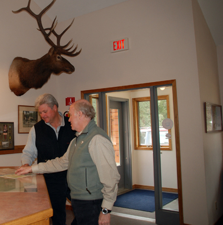 Dave Campbell talking with an outfitter at the ranger station