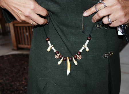 Mary shows a necklace made of elk teeth that she made while working in the Selway-Bitterroot.