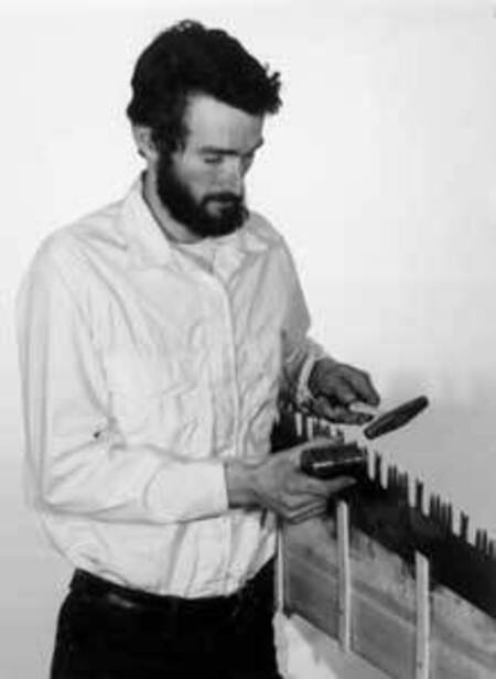 Warren Miller sharpening a crosscut saw in 1978