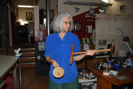 Sarah Swett, demonstrating the first handcrafted spindle she made while living in the Selway-Bitterroot Wilderness