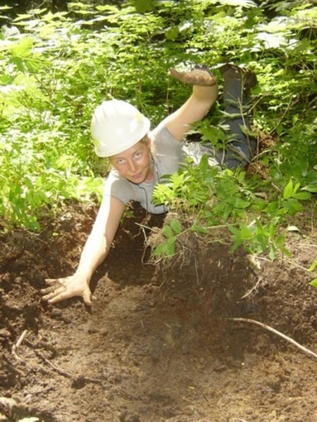 Swimming in a newly dug drainage ditch.