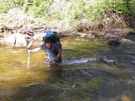 Rob Mason fording the Selway while on a work trip