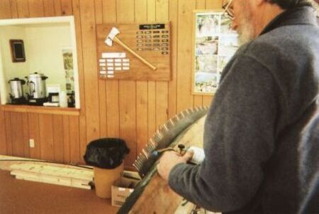 Warren Miller using a torch to temper saw teeth
