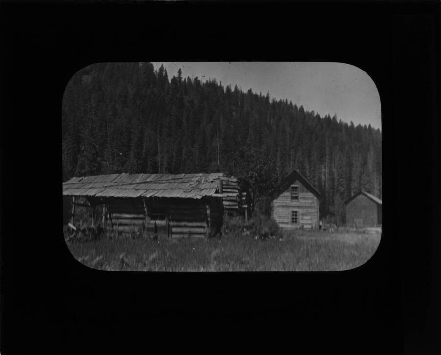 The glass slide reads: 'Pete King Cabin and new ranger station. Lowell Idaho.'