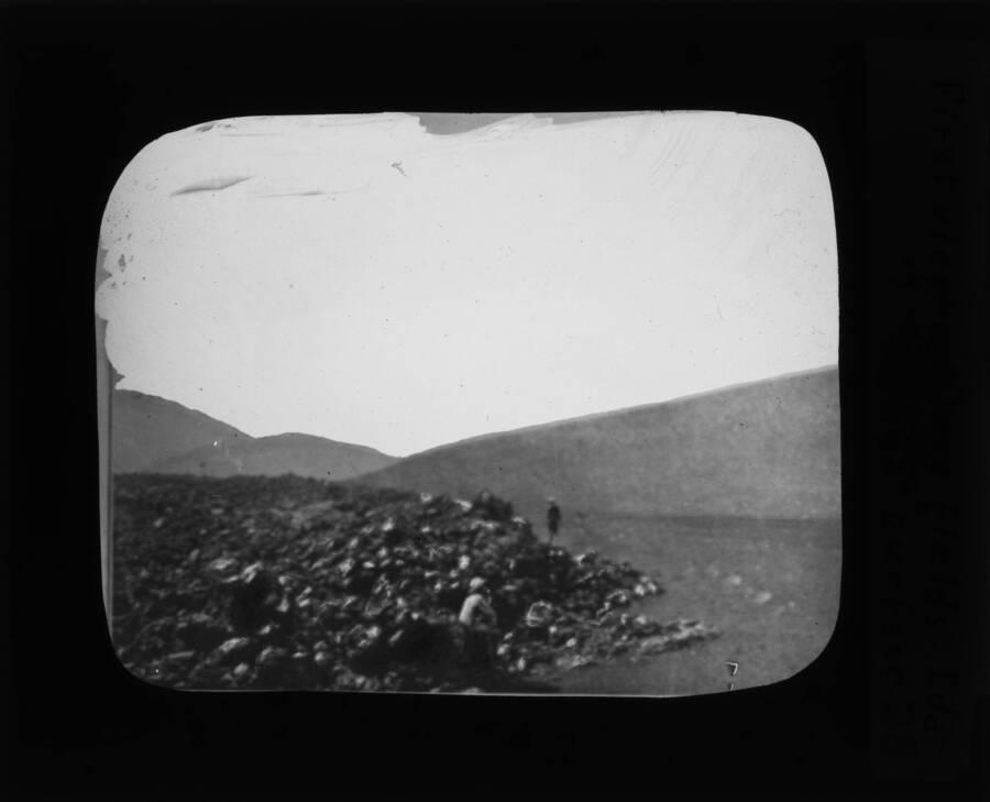 The glass slide reads: 'First view of lava fields, Idaho.'