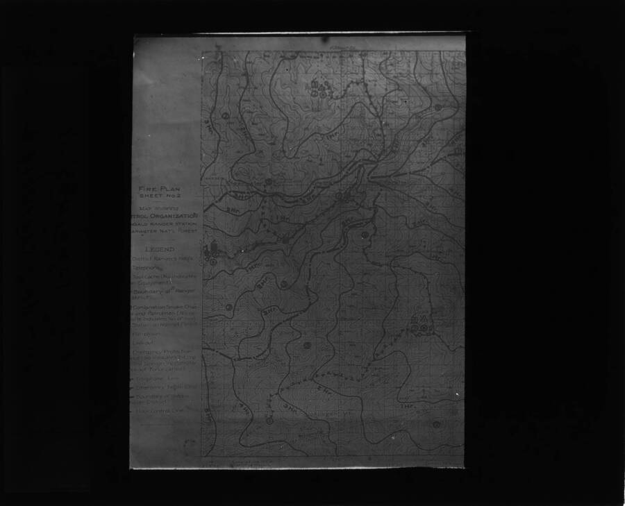 The glass slide reads: 'Firefighters' map showing contours, Idaho Mts.'