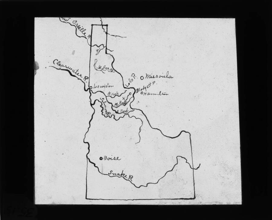 The glass slide reads: 'Map of Idaho showing major rivers and cities.'