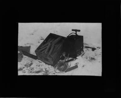 The glass slide reads: 'Equipment for blasting on Plot I. Powder - Caps - Electric fuses - Safety fuse - Battery. Fig, 8.'