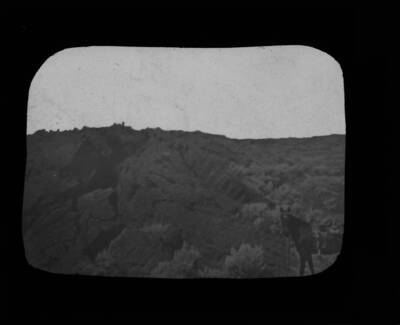 The glass slide reads: 'Pressure ridge on pahoehoe surface.'
