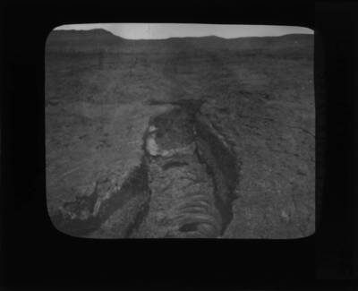 The glass slide reads: 'Lava river, Snake River Plain, Idaho.'