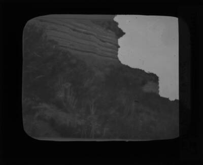 The glass slide reads: 'Stratified volcanic dust, Snake River Plain.'