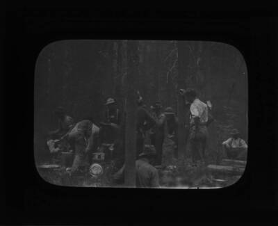 The glass slide reads: 'Firefighters at dinner, Lolo Hot Springs.'