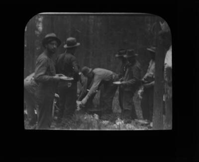 The glass slide reads: 'Fire Fighters at dinner.'