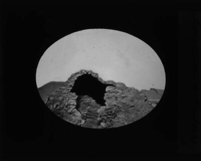 The glass slide reads: 'Lava cone (vent), Idaho.'