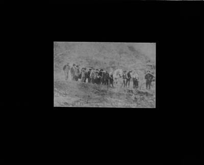 The glass slide reads: 'Firefighters and rangers, Avery, Idaho.'The glass slide reads: '
