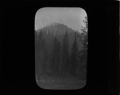 The glass slide reads: 'Burning mountain South of Powell, Idaho.'