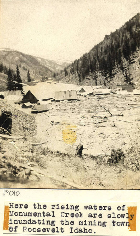 Photo caption reads: 'Here the rising waters of Monumental Creek are slowly inundating the mining town of Roosevelt Idaho.'