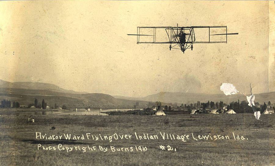 Postcard of an early airplane flying over Lewiston, Idaho. Sent in 1911.