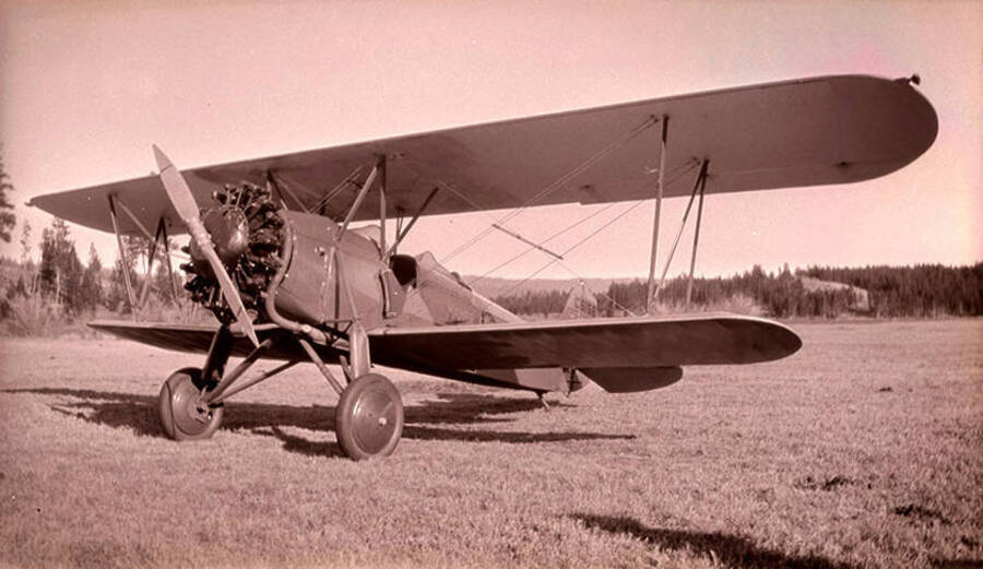 An airplane in a meadow near the Stonebraker Ranch. Pilot Nick Mamer flew this plane to the Chamberlain Basin from Spokane, Washington.