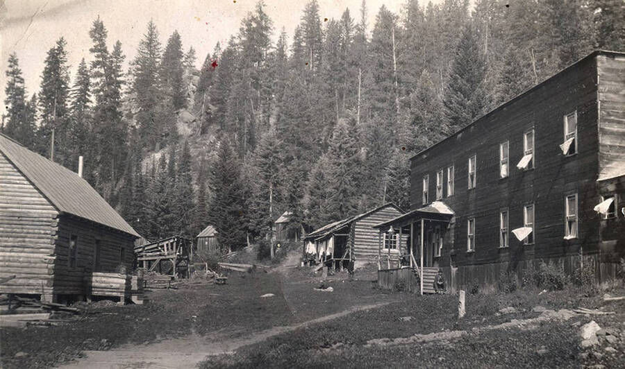 Postcard of mining camp buildings.
